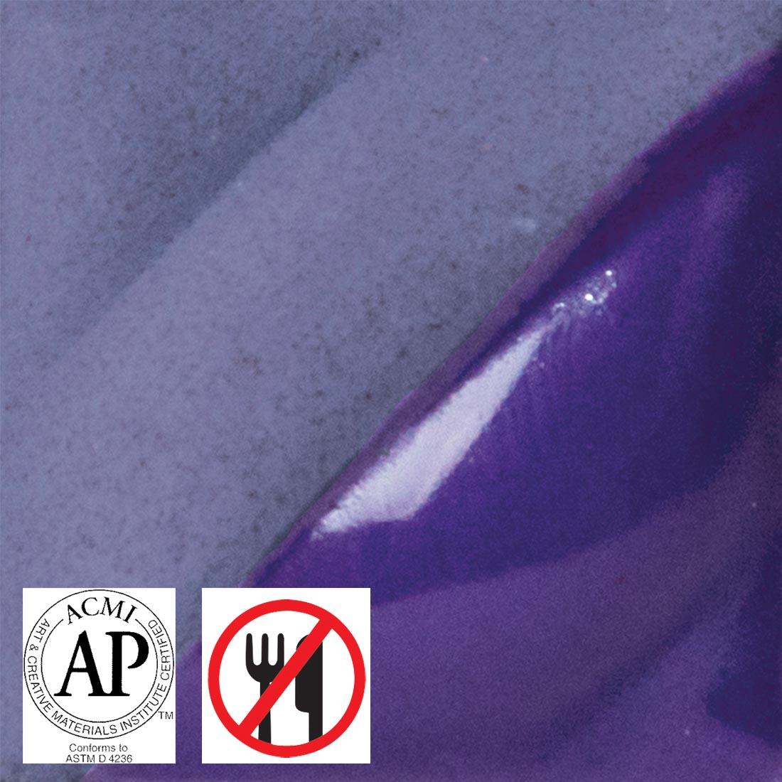 tile chip with purple AMACO Velvet Underglaze applied; symbols for AP Seal and not food safe