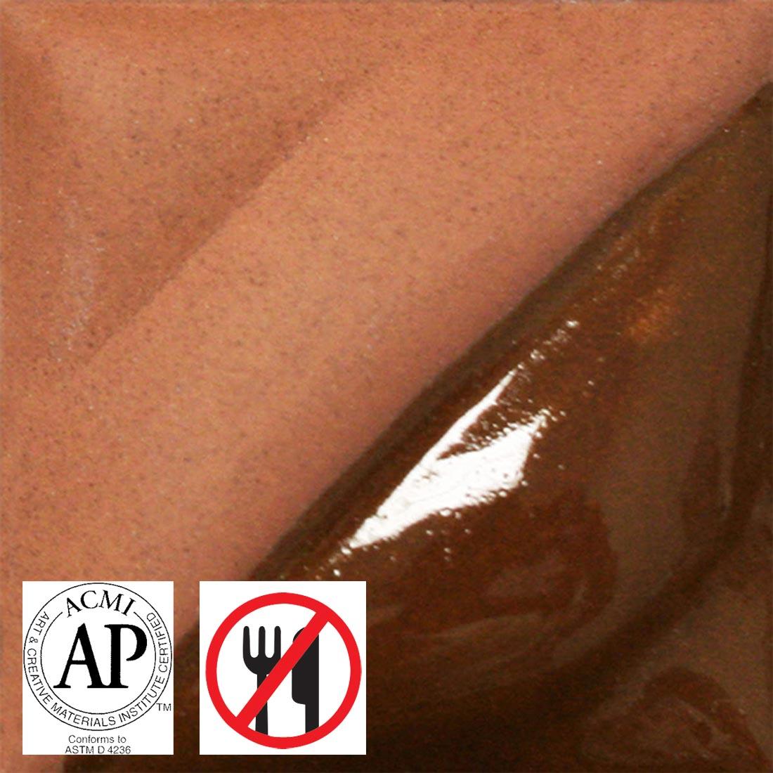 tile chip with Terra Cotta AMACO Velvet Underglaze applied; symbols for AP Seal and not food safe