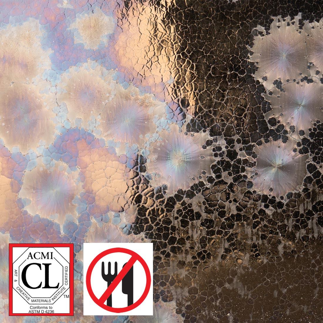 clay tile with Event Horizon AMACO Cosmos High Fire Glaze applied; symbols for Cautionary Label and not food safe