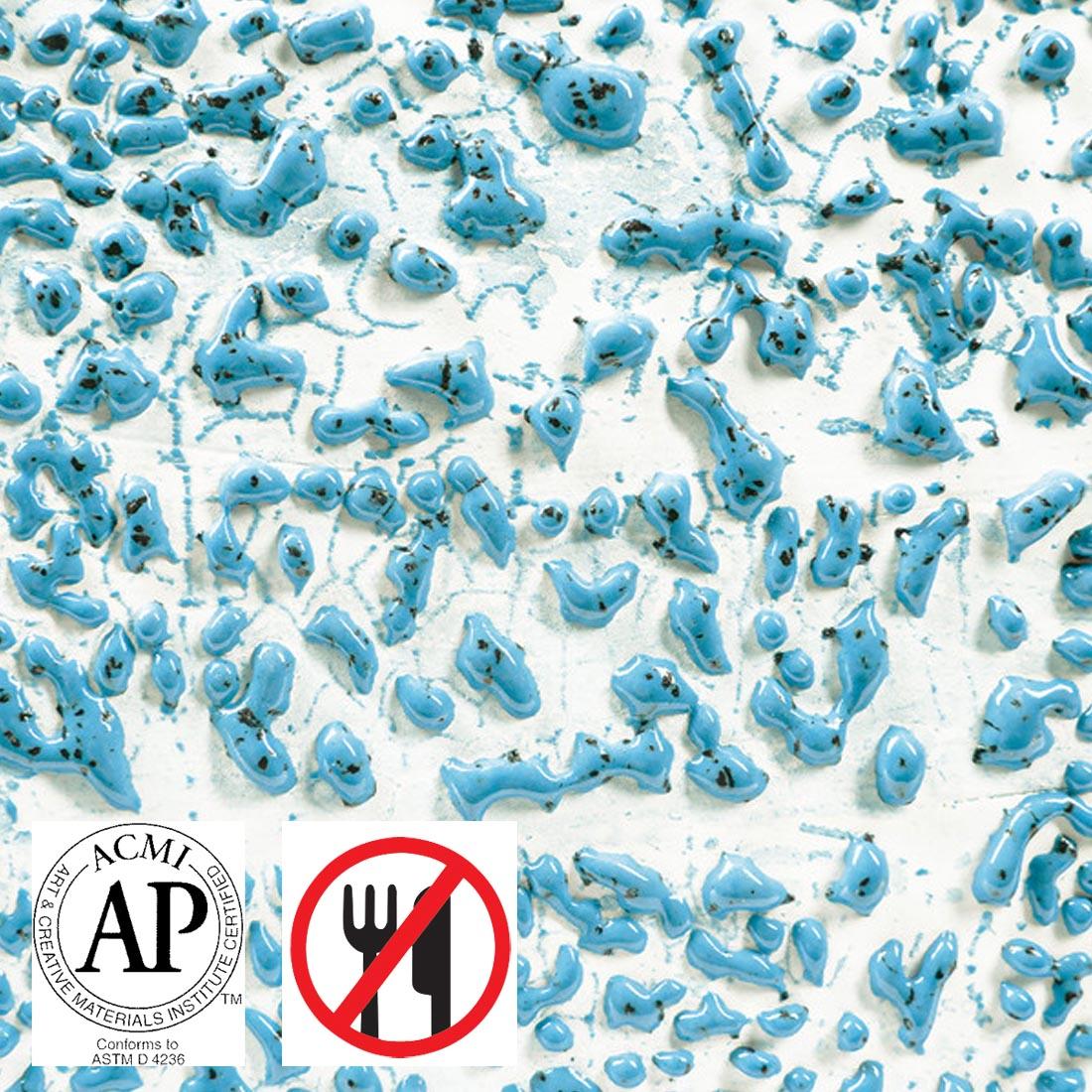 Clay tile with Speckled Teal AMACO Crawls High Fire Glaze applied plus symbols for AP Seal and not food safe