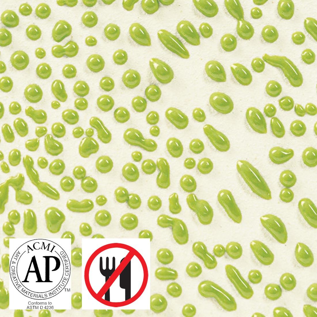 Clay tile with Lime AMACO Crawls High Fire Glaze applied plus symbols for AP Seal and not food safe
