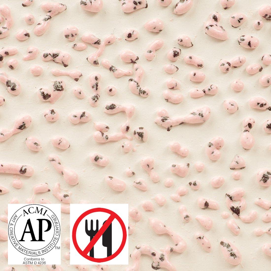 Clay tile with Speckled Pink AMACO Crawls High Fire Glaze applied plus symbols for AP Seal and not food safe