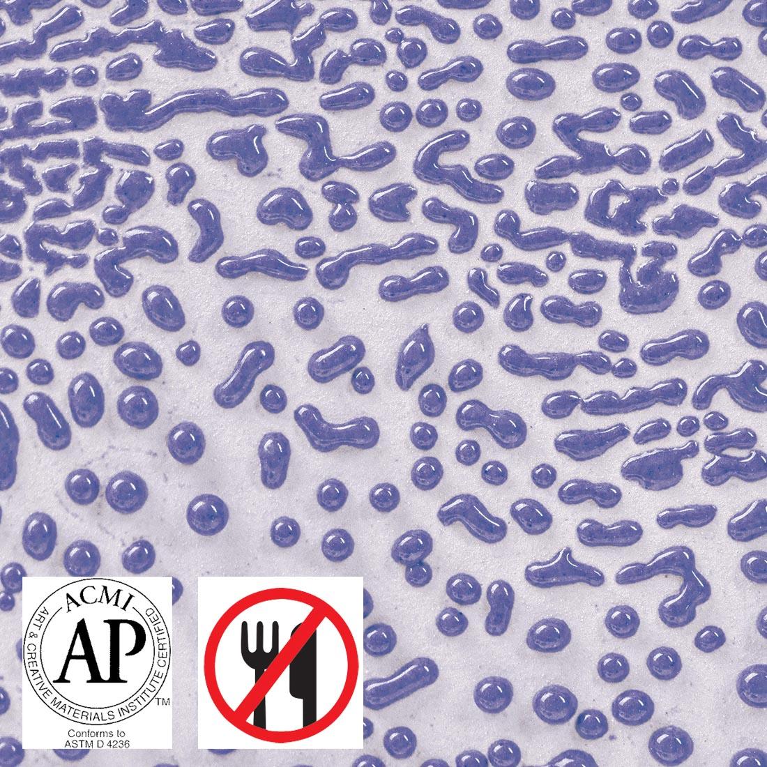 Clay tile with Purple AMACO Crawls High Fire Glaze applied plus symbols for AP Seal and not food safe