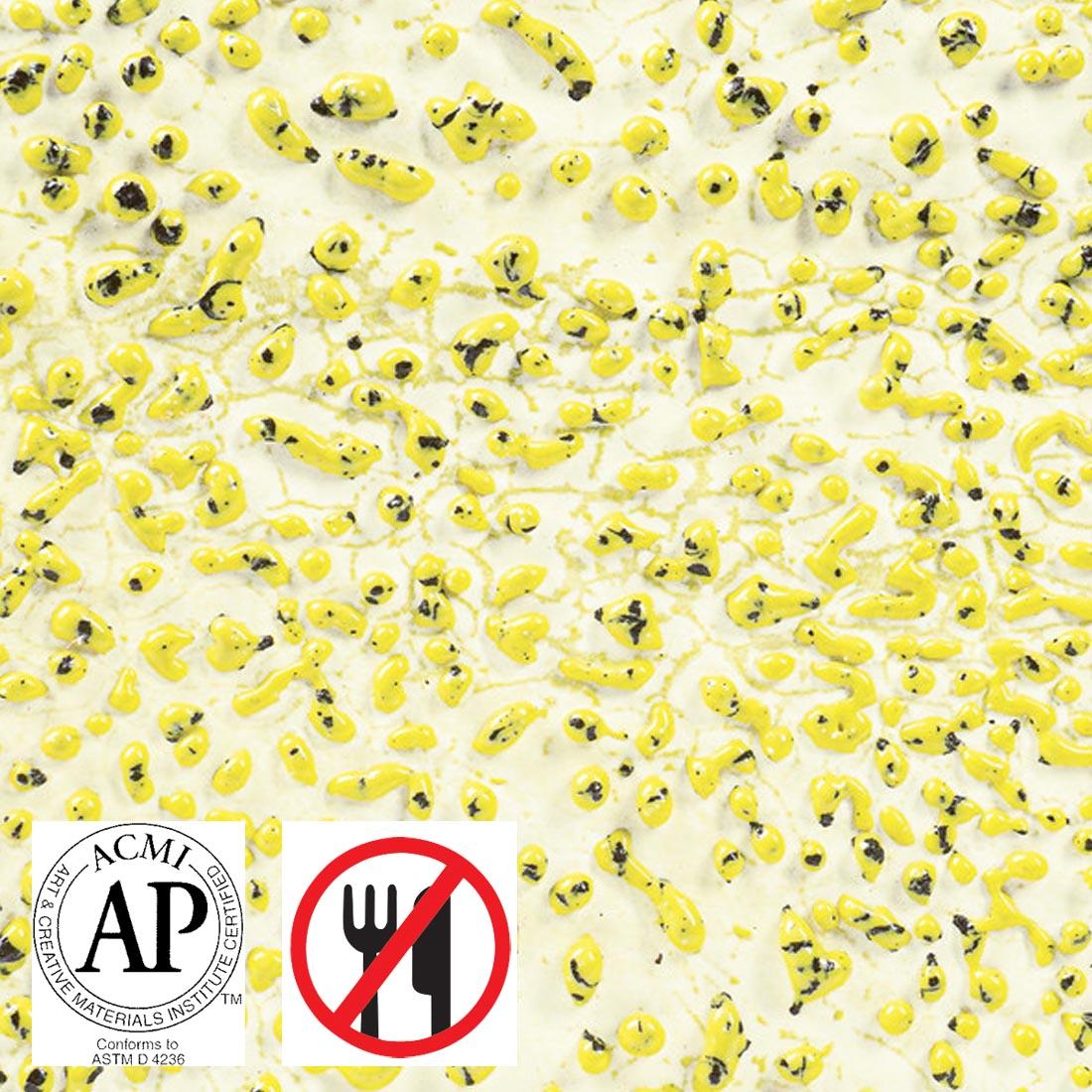 Clay tile with Speckled Yellow AMACO Crawls High Fire Glaze applied plus symbols for AP Seal and not food safe