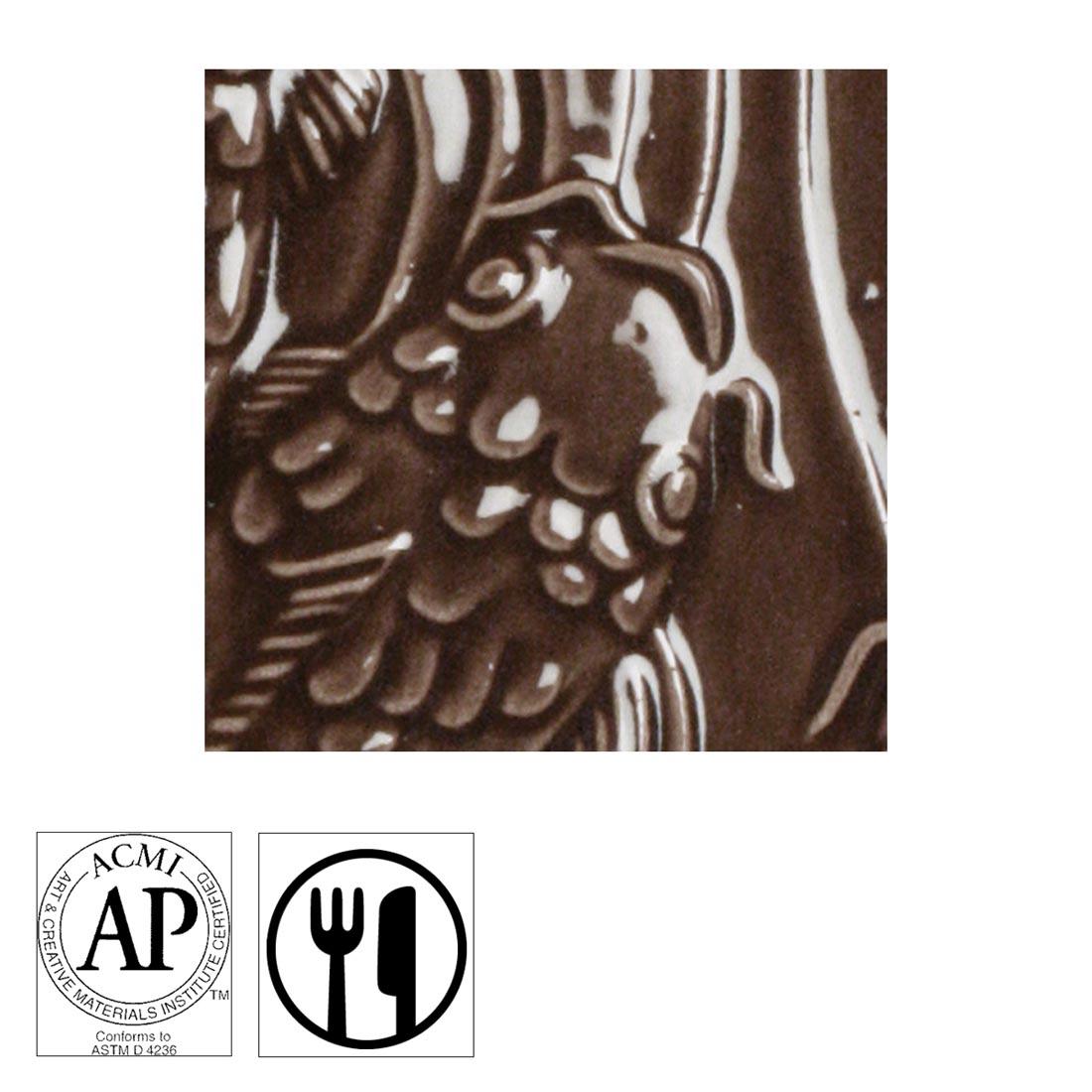 clay tile with Chocolate Brown AMACO Gloss Glaze applied; symbols for AP Seal and food safe