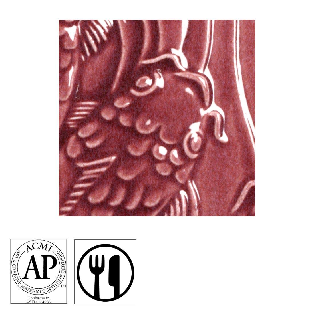 clay tile with Red Brown AMACO Gloss Glaze applied; symbols for AP Seal and food safe