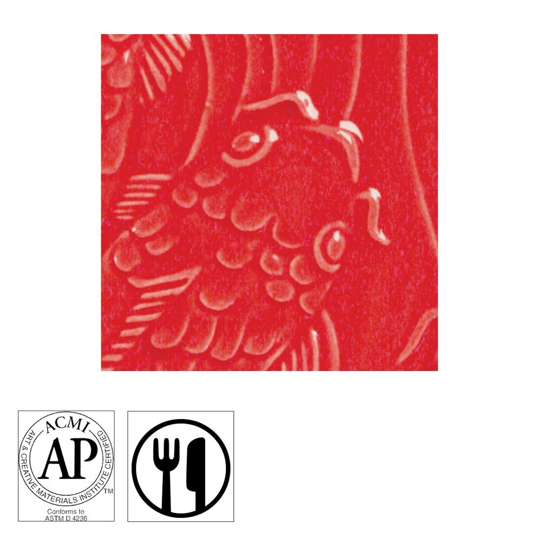 clay tile with Brilliant Red AMACO Gloss Glaze applied; symbols for AP Seal and food safe