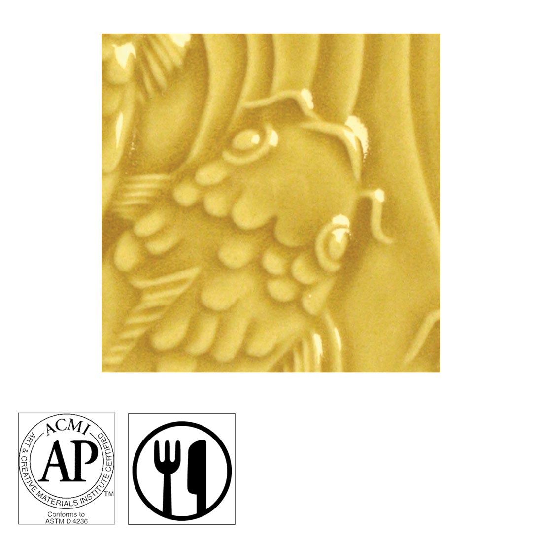 clay tile with Dark Yellow AMACO Gloss Glaze applied; symbols for AP Seal and food safe