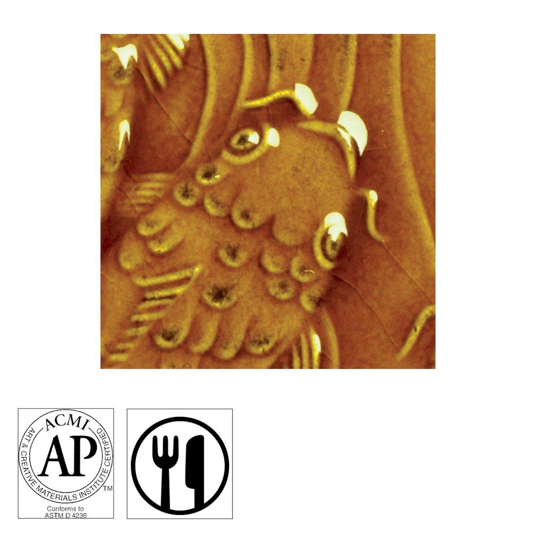 clay tile with Amber AMACO Gloss Glaze applied; symbols for AP Seal and food safe