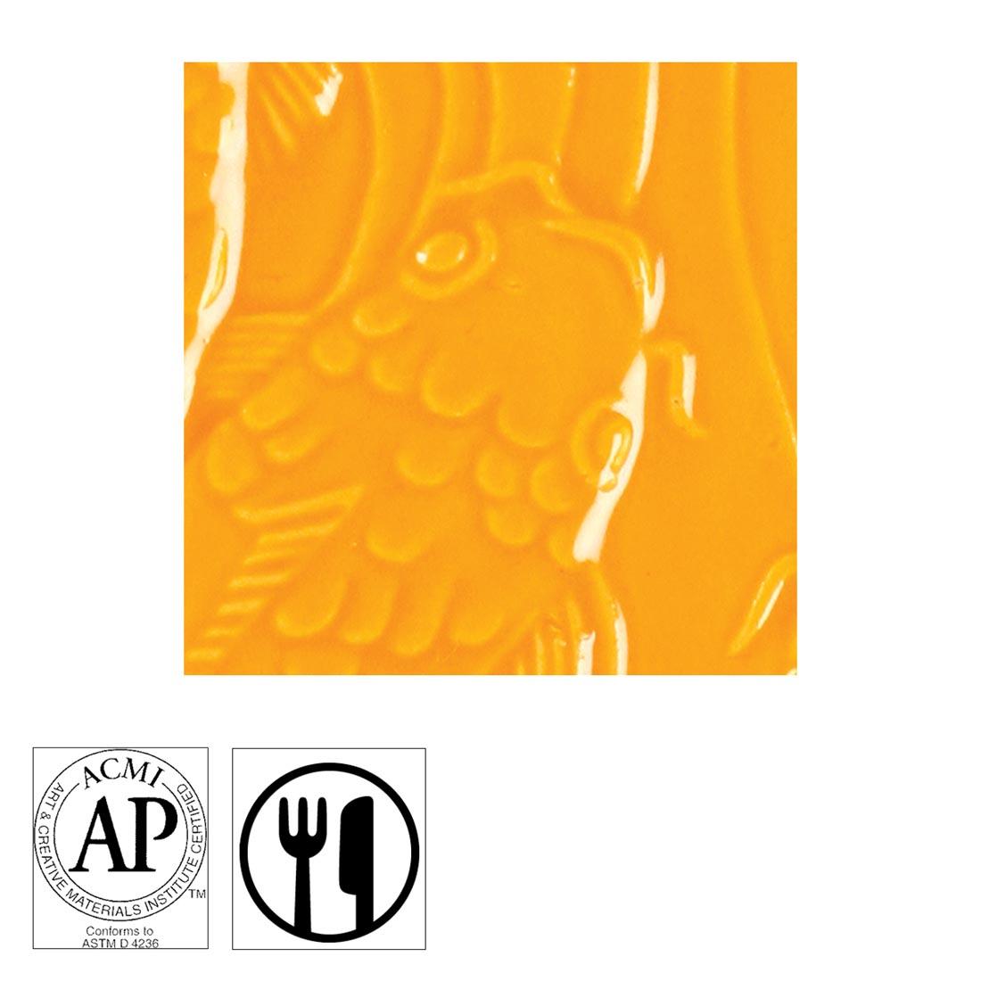 clay tile with Vivid Orange AMACO Gloss Glaze applied; symbols for AP Seal and food safe