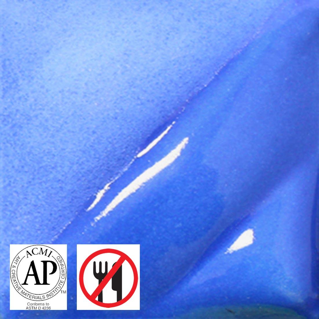 clay tile with Medium Blue AMACO Liquid Underglaze Decorating Color applied; symbols for AP Seal and not food safe