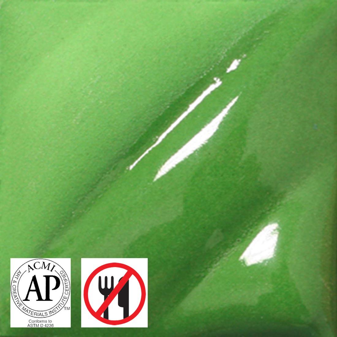 clay tile with Dark Green AMACO Liquid Underglaze Decorating Color applied; symbols for AP Seal and not food safe