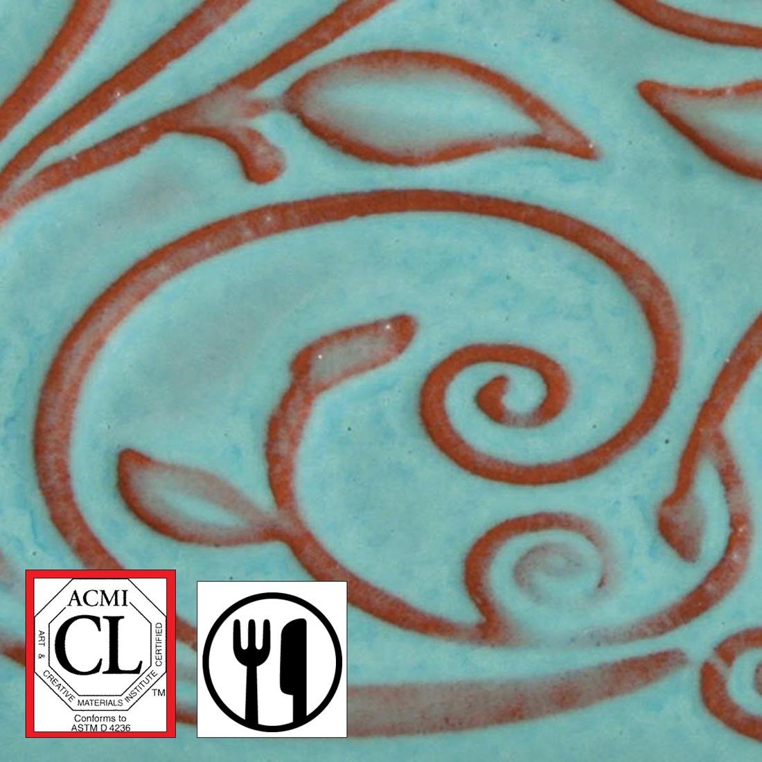 clay tile with Bluebell AMACO Opalescent Glaze applied; symbols for Cautionary Label and food safe