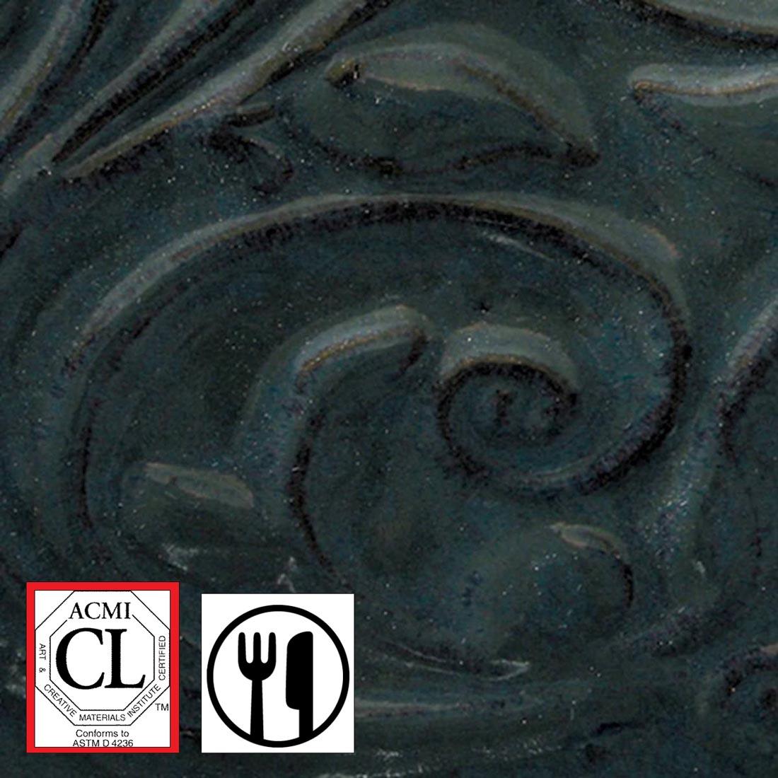 clay tile with Black Tulip AMACO Opalescent Glaze applied; symbols for Cautionary Label and food safe