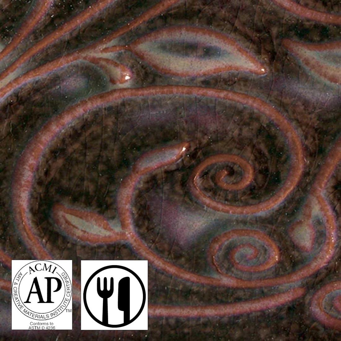 clay tile with Mottled Burgundy AMACO Opalescent Glaze applied; symbols for AP Seal and food safe