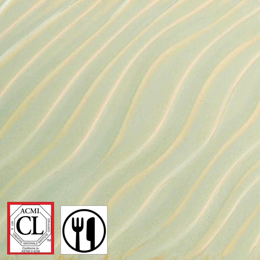 clay tile with Honeydew AMACO Potter's Choice Flux High Fire Glaze applied; symbols for Cautionary Label and food safe
