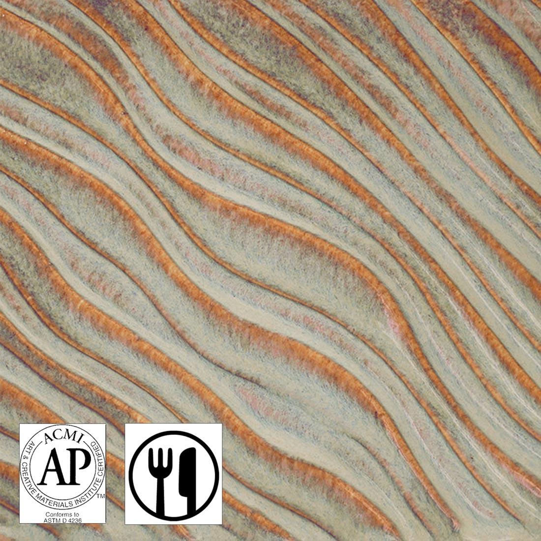 Clay tile with Mystic Tide AMACO Potter's Choice Flux High Fire Glaze applied plus symbols for AP Seal and Food Safe