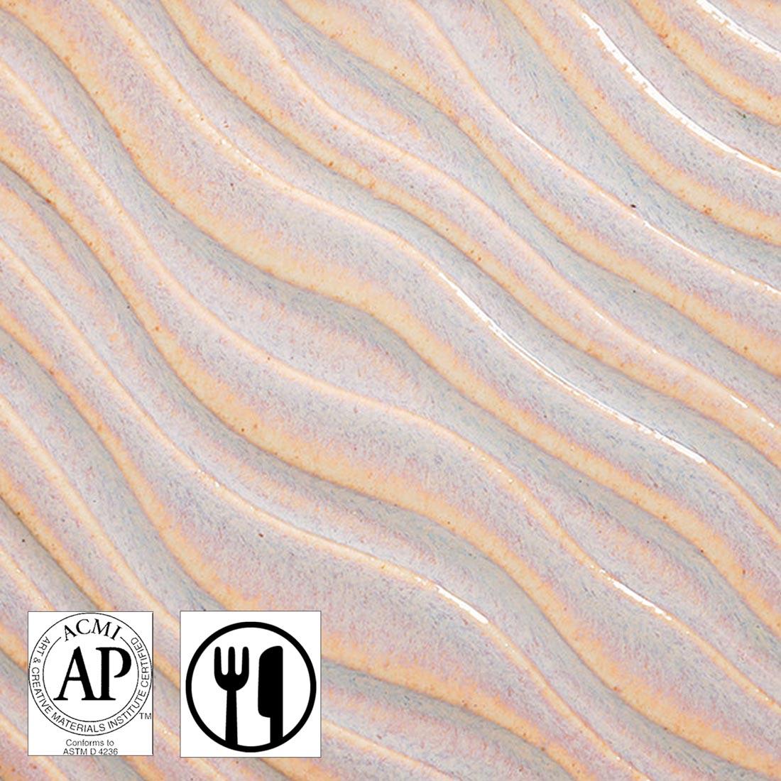 Clay tile with Rose Mist AMACO Potter's Choice Flux High Fire Glaze applied plus symbols for AP Seal and Food Safe