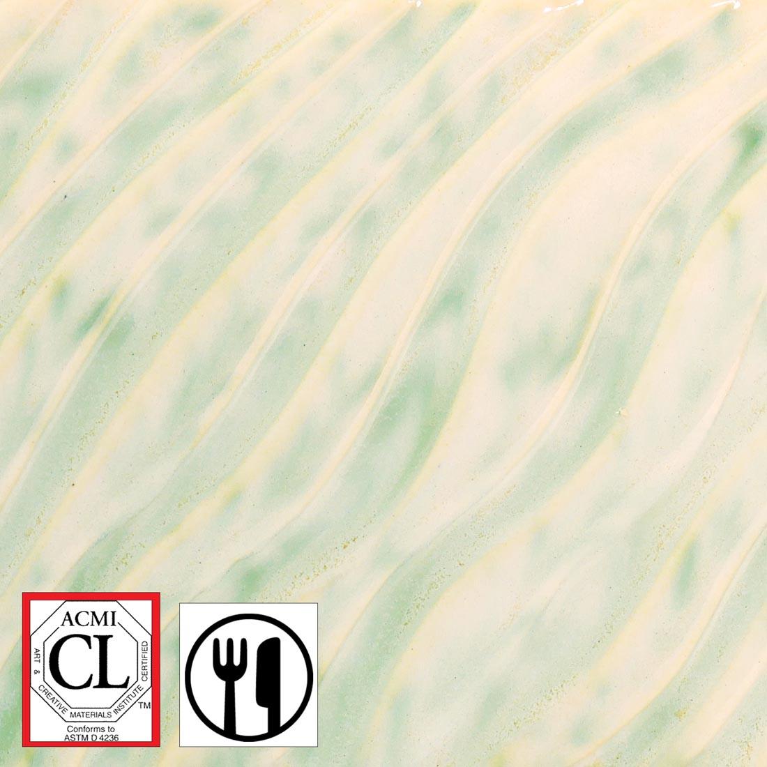 clay tile with Moss Mist AMACO Potter's Choice Flux High Fire Glaze applied; symbols for Cautionary Label and food safe