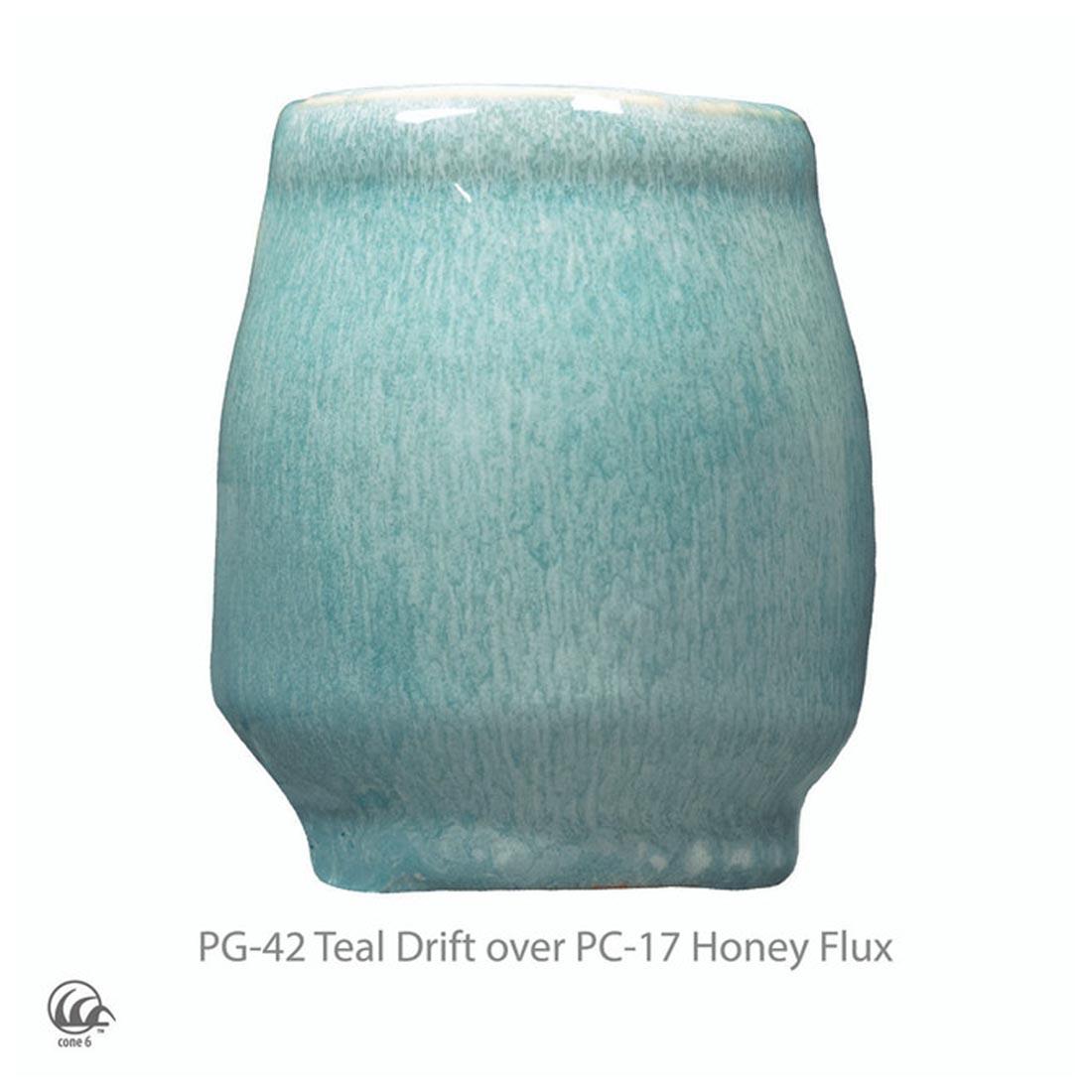 example clay sculpture with AMACO Phase High Fire Glaze applied plus text PG-42 Teal Drift over PC-17 Honey Flux plus icon symbol for cone 6