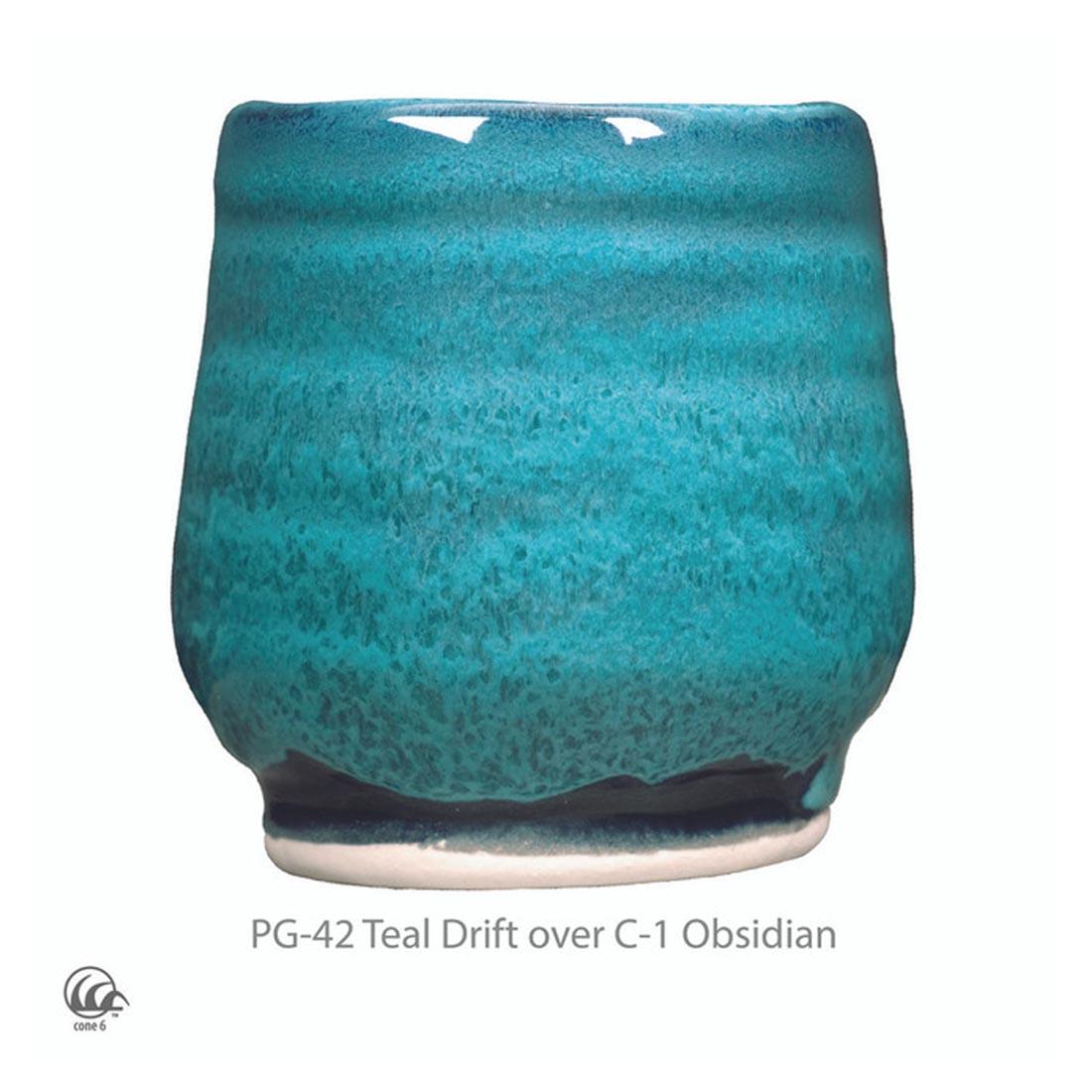example clay sculpture with AMACO Phase High Fire Glaze applied plus text PG-42 Teal Drift over C-1 Obsidian plus icon symbol for cone 6