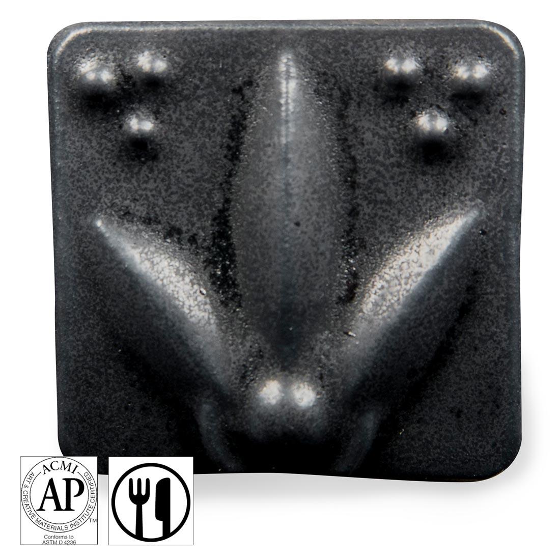 clay tile with Black AMACO Satin Matte Glaze applied; symbols for AP Seal and food safe