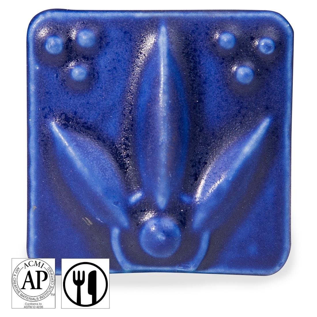 clay tile with Dark Blue AMACO Satin Matte Glaze applied; symbols for AP Seal and food safe