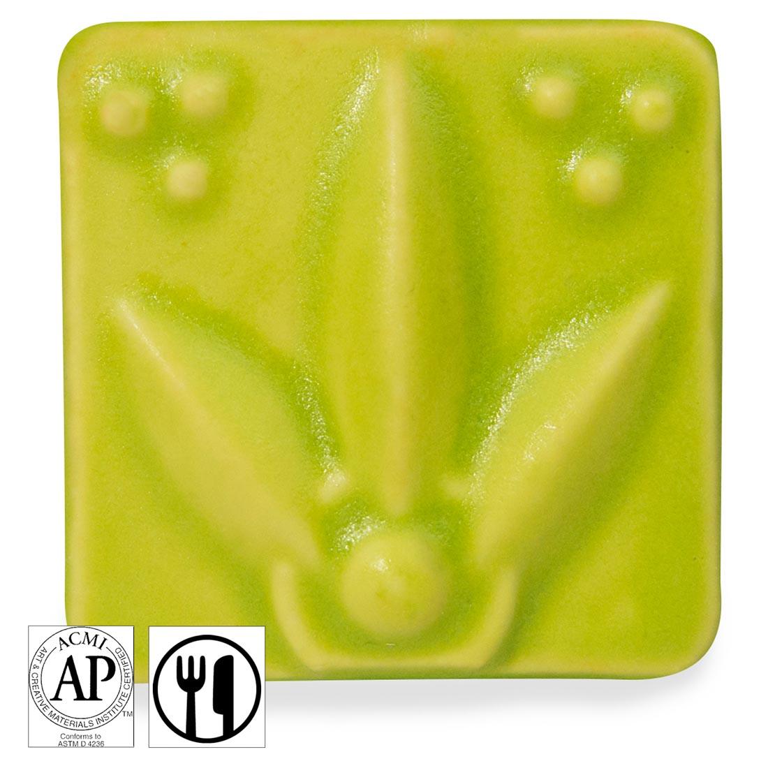 clay tile with Chartreuse AMACO Satin Matte Glaze applied; symbols for AP Seal and food safe