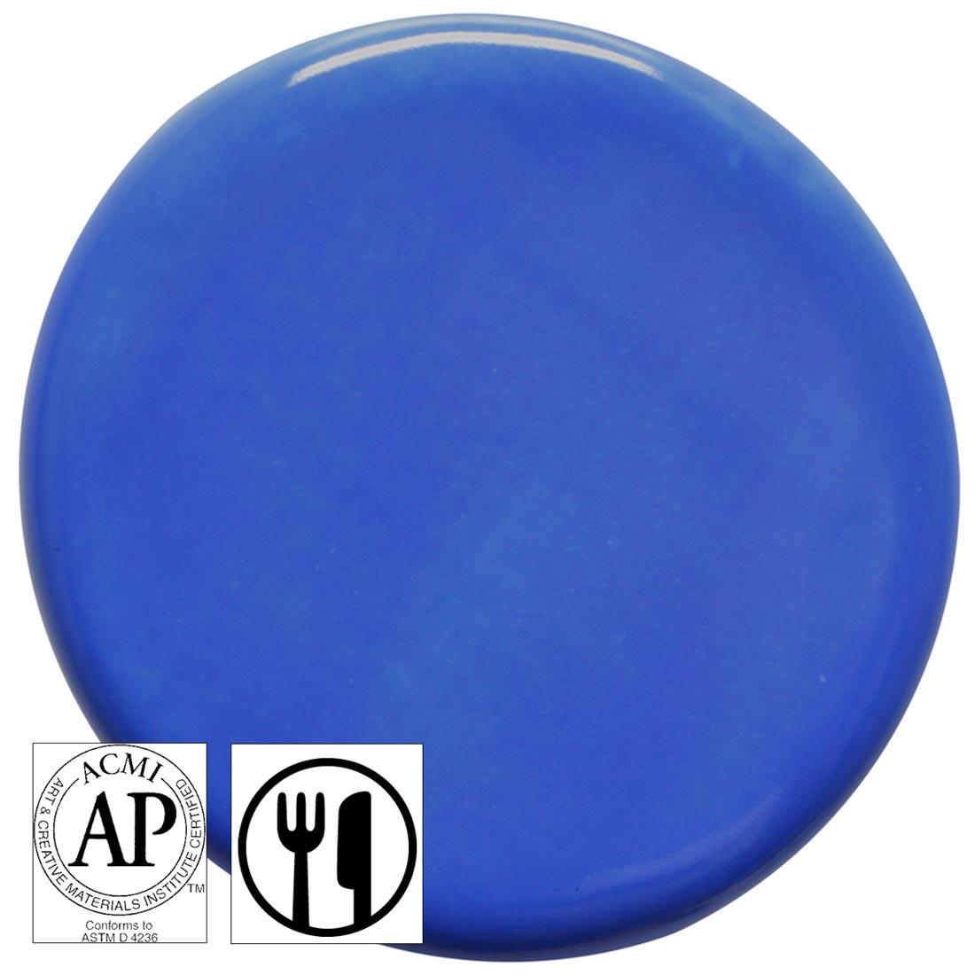 clay tile with Medium Blue AMACO Teacher's Palette Gloss Glaze applied; symbols for AP Seal and food safe