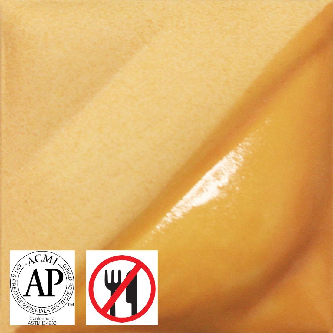 clay tile with Straw AMACO Velvet Underglaze applied; symbols for AP Seal and not food safe