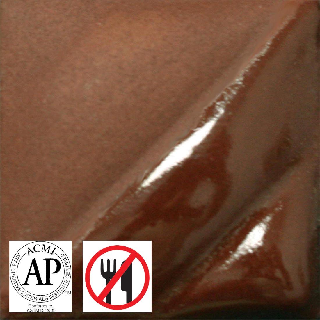 clay tile with Red Brown AMACO Velvet Underglaze applied; symbols for AP Seal and not food safe