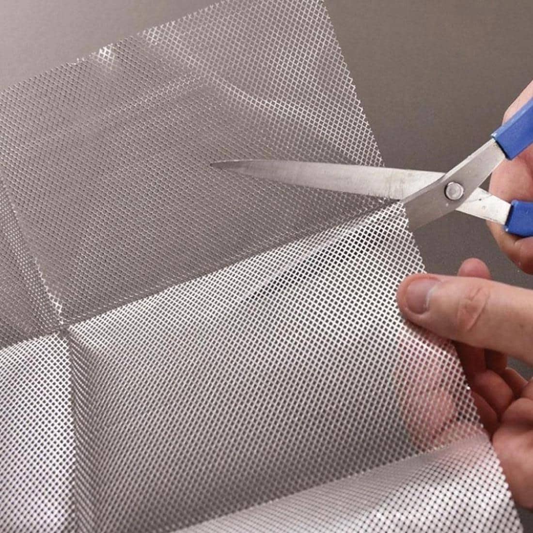 hands using scissors to cut Activa Activ-Wire Sculptural & Modeling Large Wire Mesh