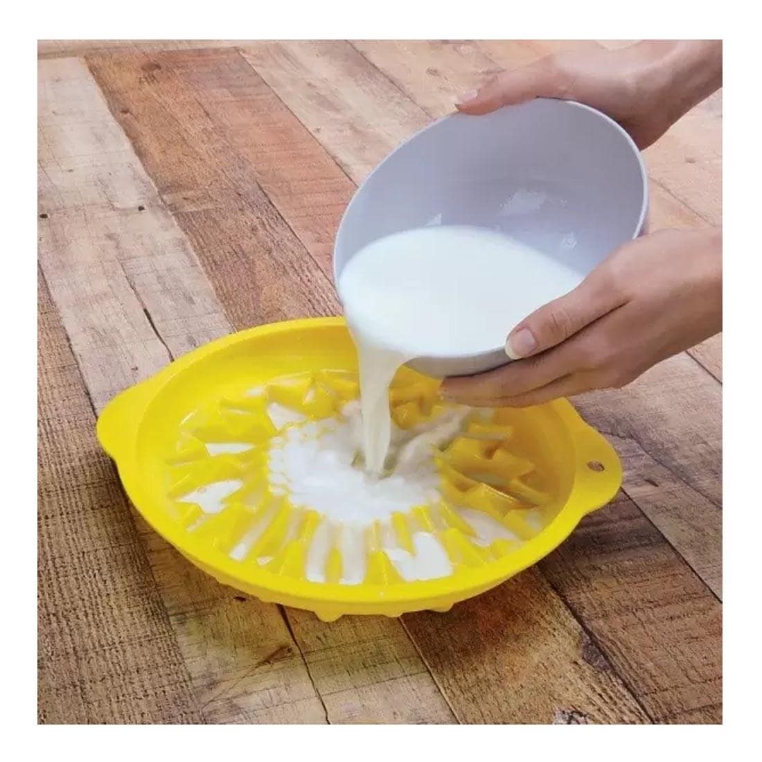 Hands pouring Activa ArtPlaster Professional Casting Plaster from a bowl into a mold