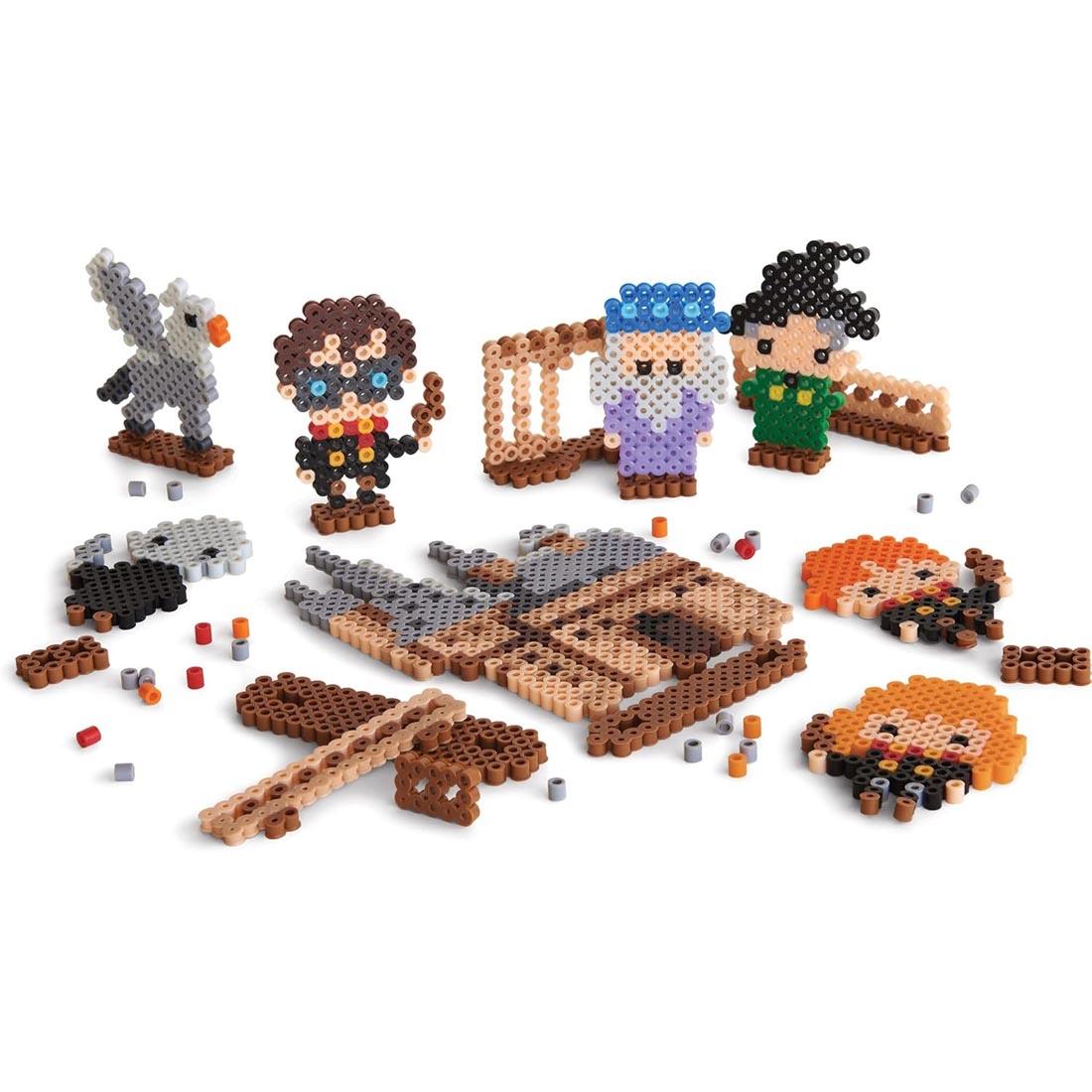 Several finished pieces made from the Perler Beads Harry Potter Fused Bead Kit
