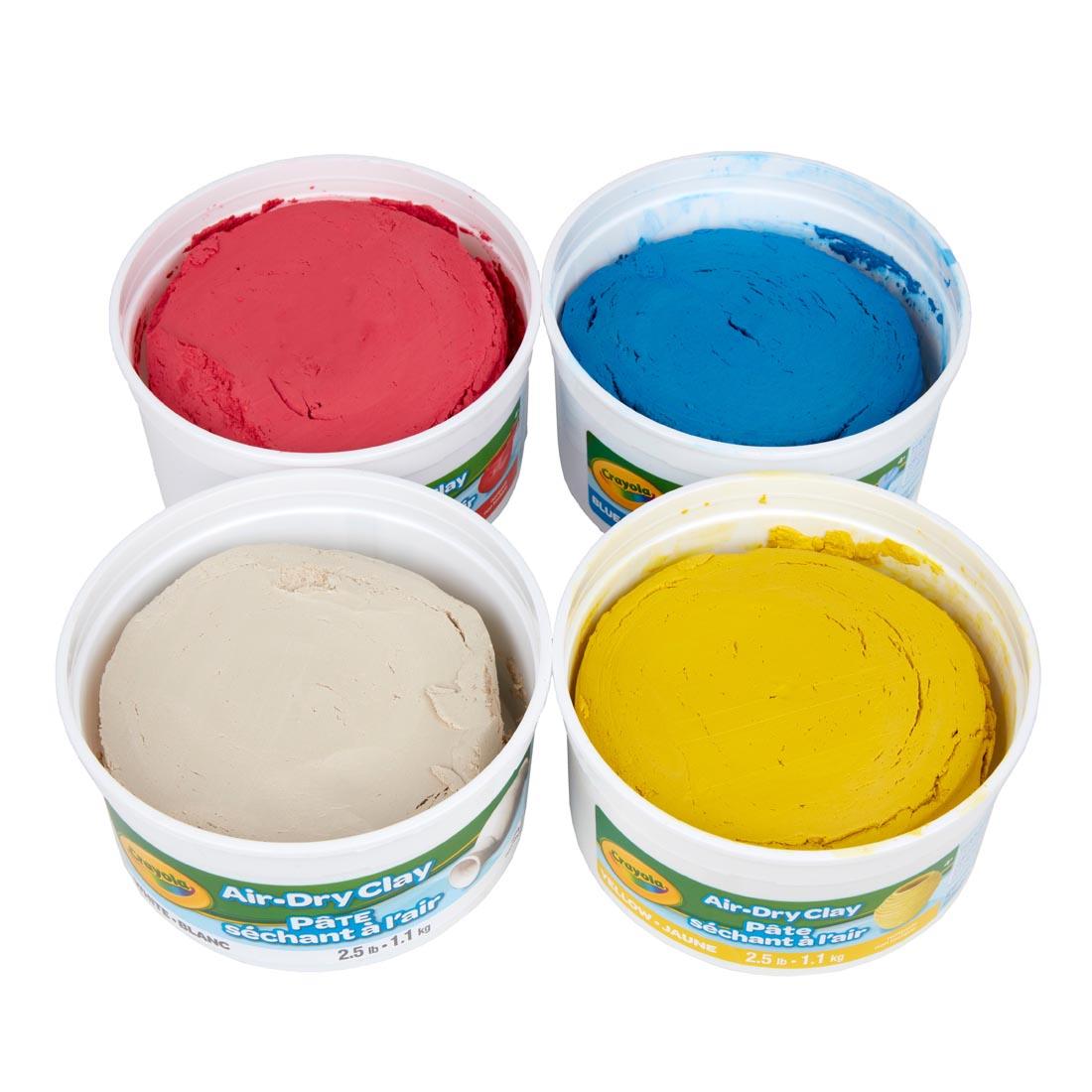 Four open tubs of Crayola Air-Dry Clay from the 10 lb. Bulk Package