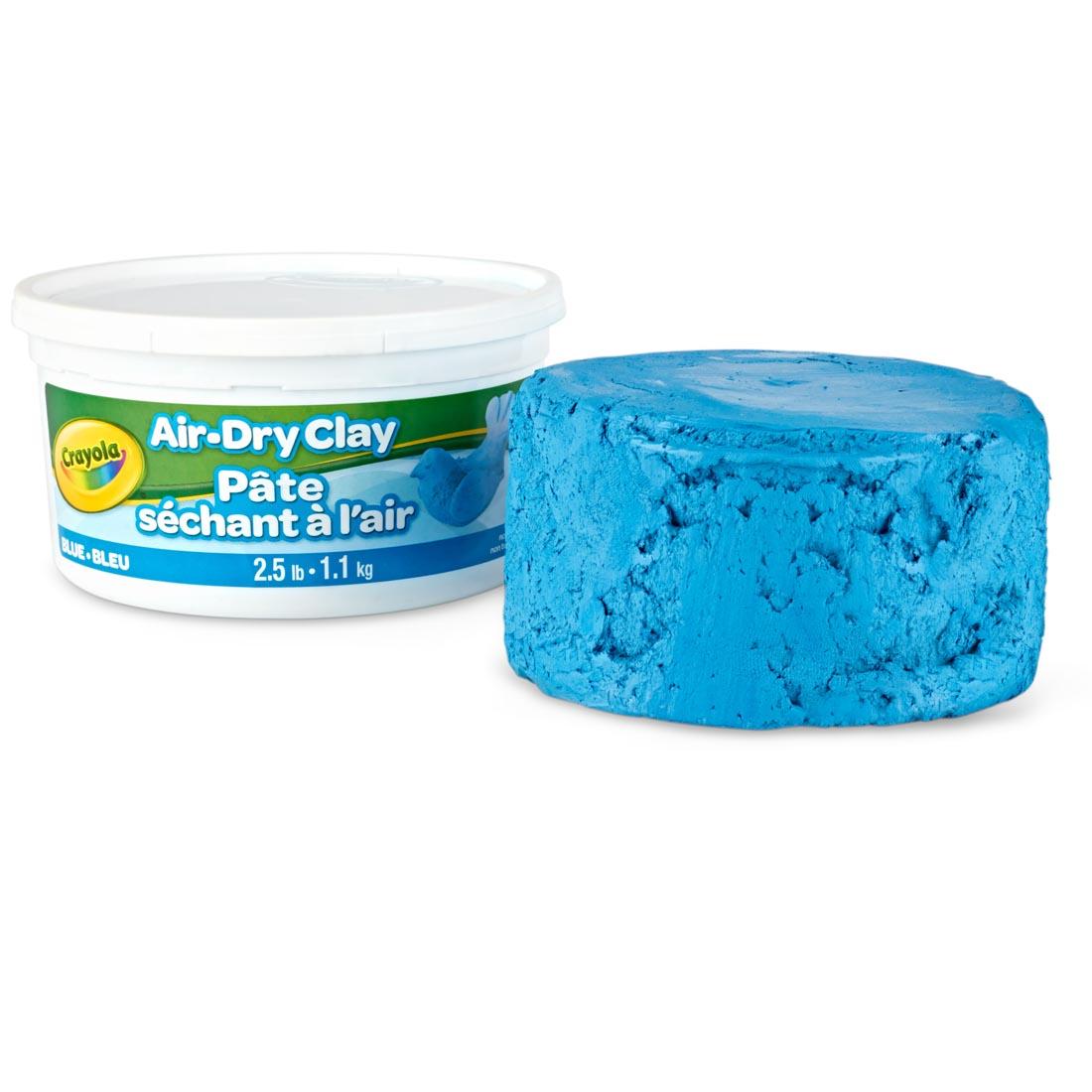 Lump of Blue Crayola Air-Dry Clay beside its container