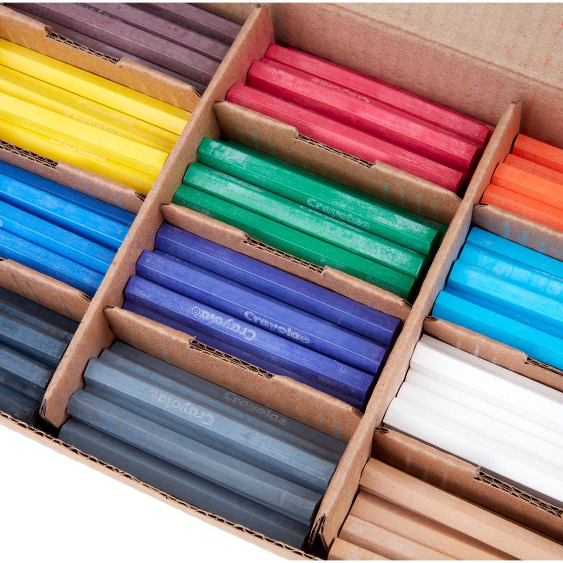close up of open box of Crayola Color Sticks Classpack Box, showing 12 colors of sticks in different compartments