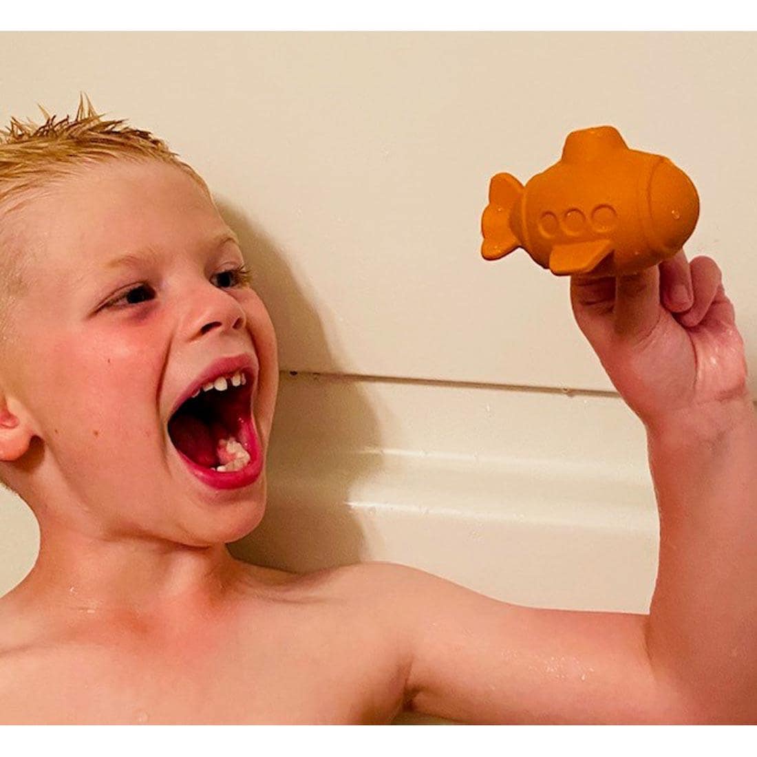 Child playing with Submarine Bathtub Pal by BeginAgain Toys