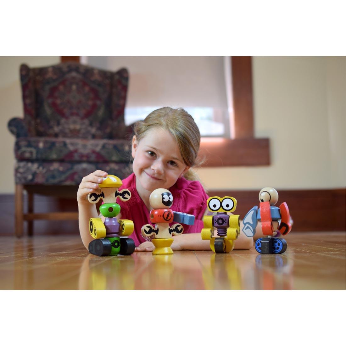 child playing with Tinker Totter Robot Character Set by BeginAgain Toys