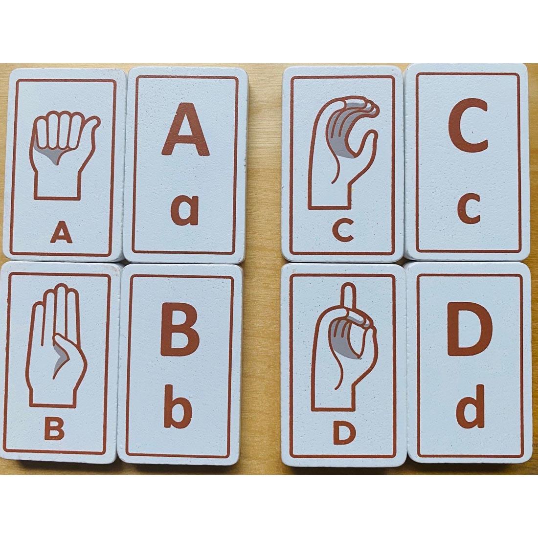 Letters A-D of Sign Language Alphabet Tiles by BeginAgain Toys