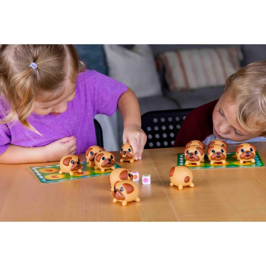 Two children playing the Tongues Out! The Squishy Squeezy Memory Game