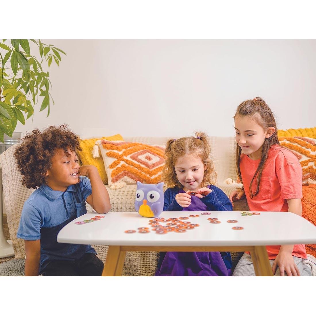 three children playing the Hoot Or Toot Memory Game