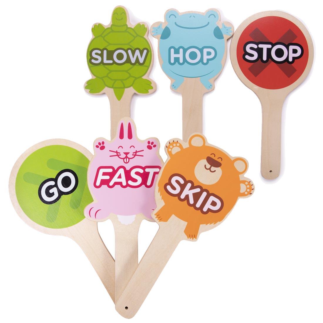 Wooden hand paddles with words printed: slow, hop, stop, go, fast and skip
