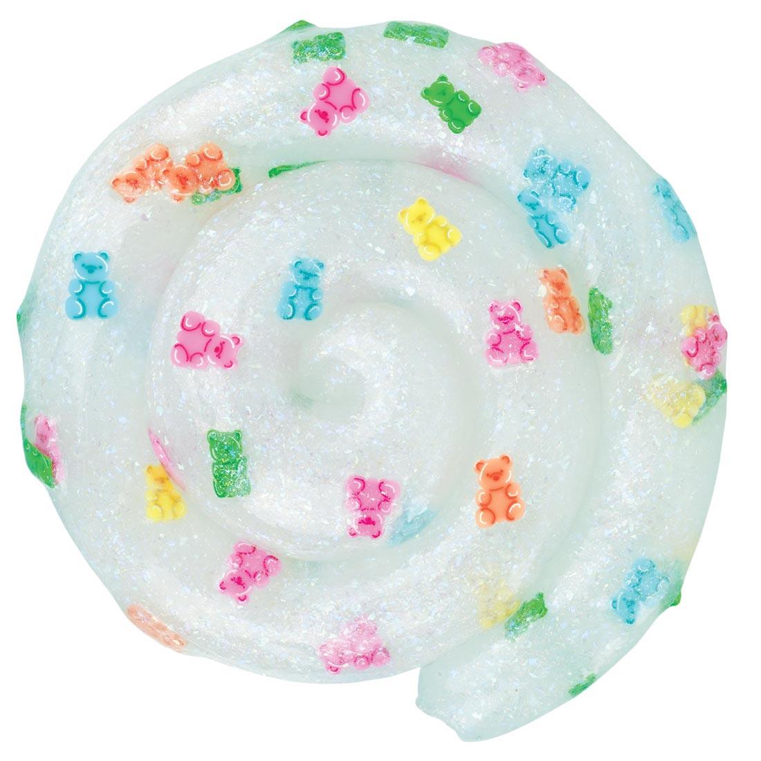 opal-colored thinking putty with colorful clay pieces that are shaped like gummy bears