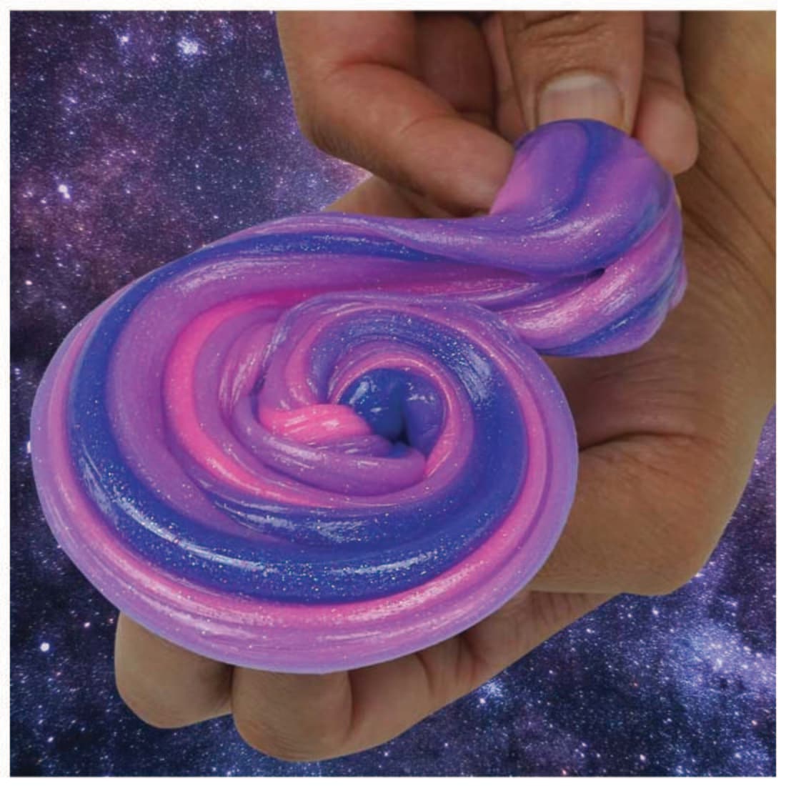 hands holding Triple Change Intergalactic Thinking Putty