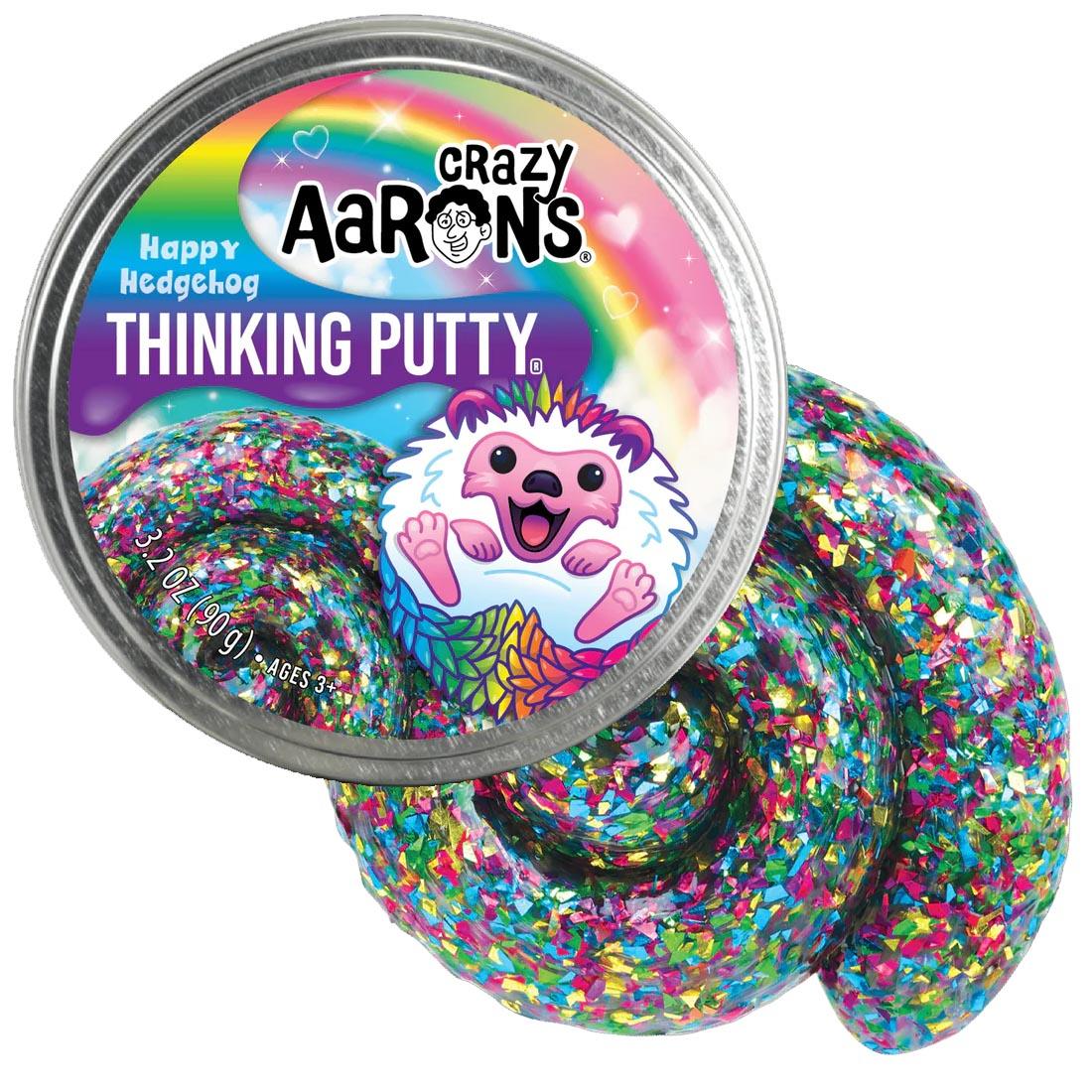 front of tin beside the Happy Hedgehog Thinking Putty by Crazy Aaron