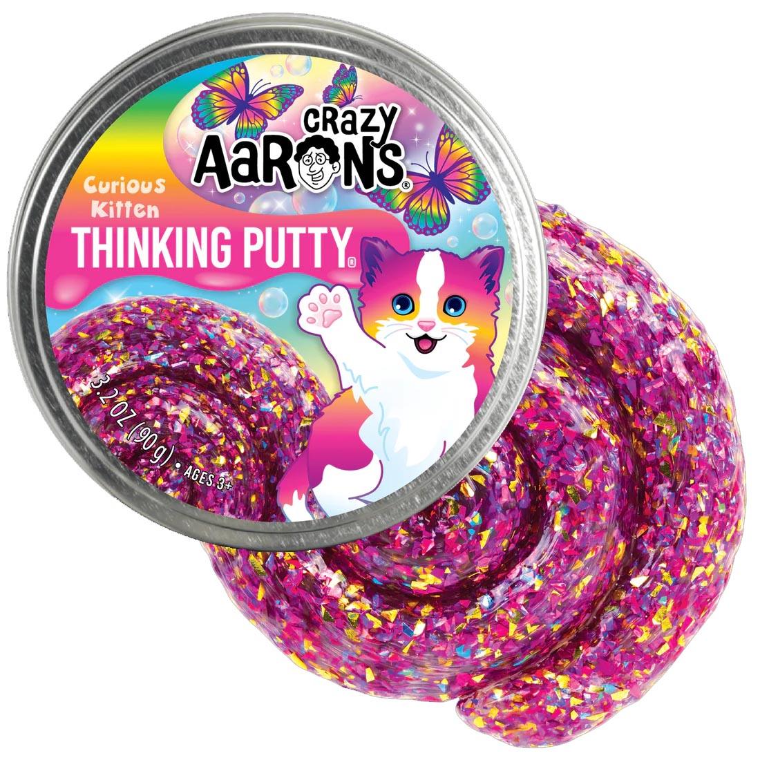 front of tin beside the Curious Kitten Thinking Putty by Crazy Aaron
