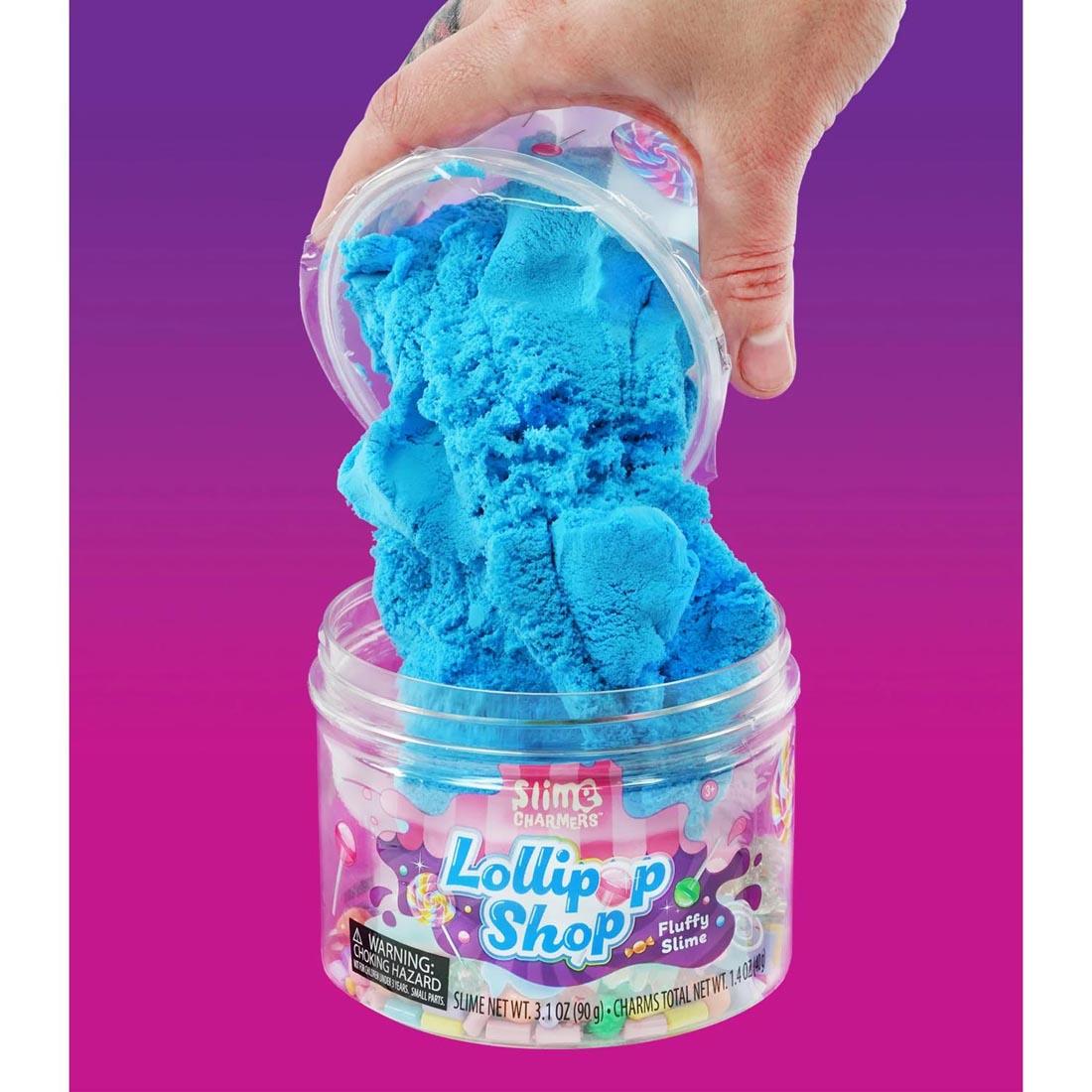 hand pouring the slime into the main container of Lollipop Shop Slime Charmers By Crazy Aaron