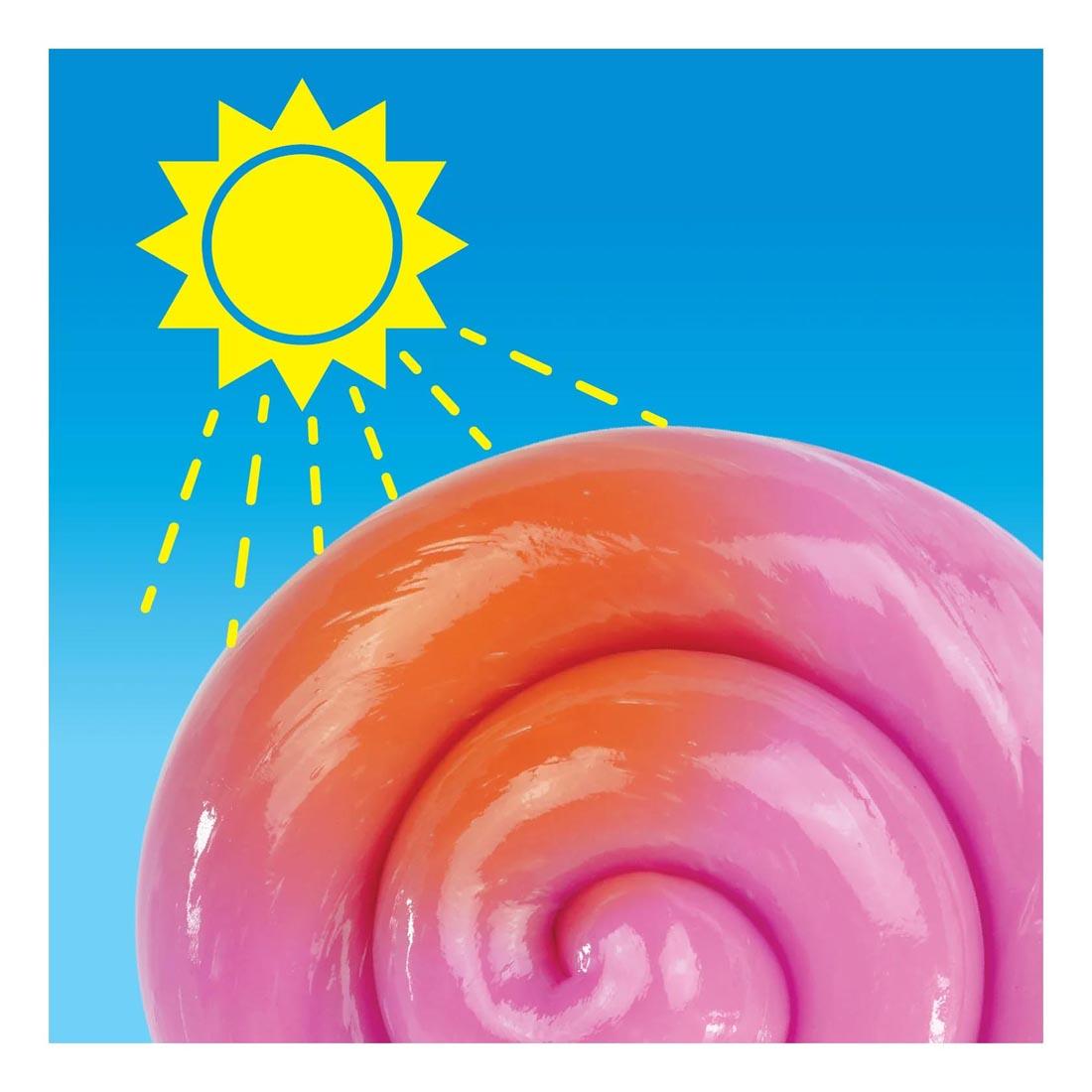 drawn sun shining down on Rainbow Reveal Thinking Putty by Crazy Aaron that's turning from pink to orange