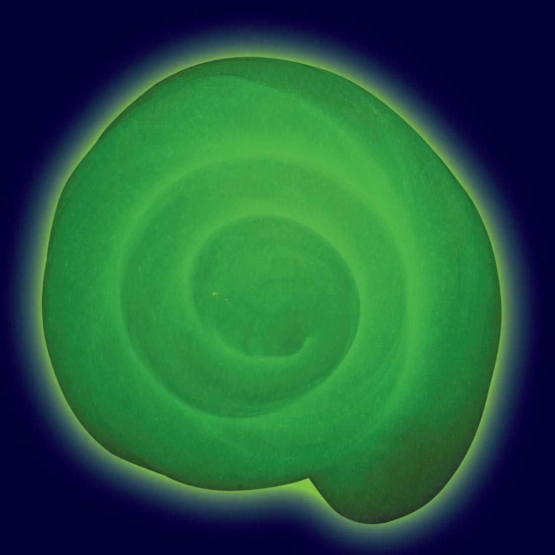 Rainbow Reveal Thinking Putty by Crazy Aaron that has turned into a glow-in-the-dark green color